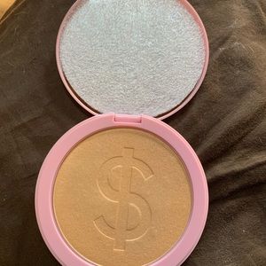 Kylie Cosmetics pressed body glow highlighter.